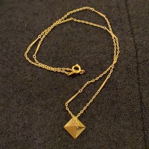 Gold necklace with pyramid charm